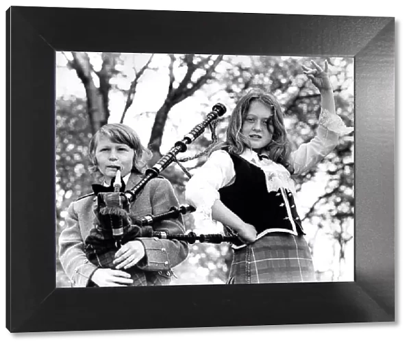Brother and sister Glen Fraser, 14, playing the bagpipes and Lisa, 12 in June 1974