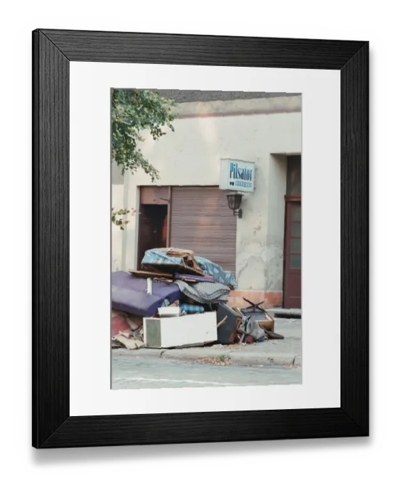 Framed Print : Furniture piled on street outside business which has recently closed in East Berlin Framed Print : Furniture piled on street outside business which has recently closed in East Berlin
