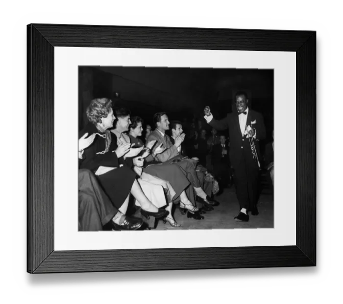 Framed Print : American jazz musician Louis Armstrong acknowledges the cheers of the fans as he enters