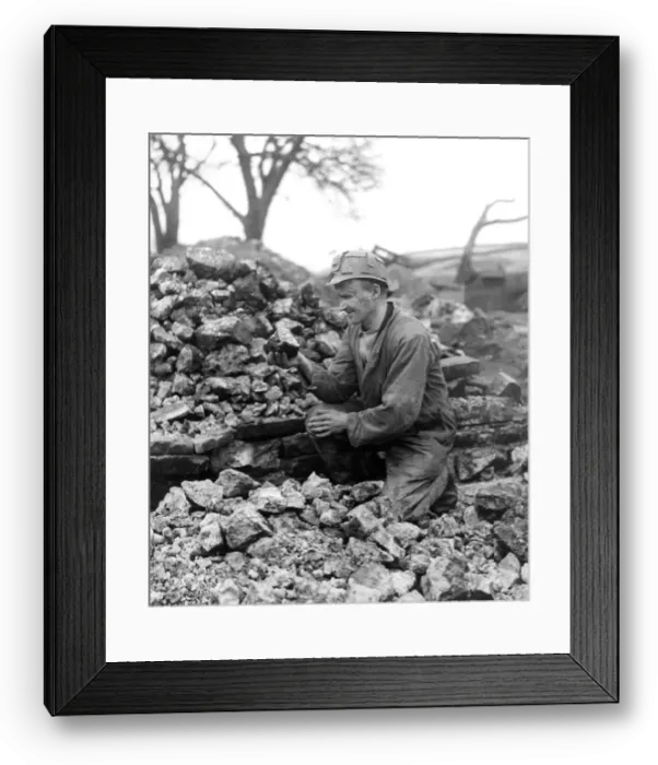 Framed Print : This is fluorspar being examined by mr. Eric Richardson at the Coalclough Lead Mine in Framed Print : This is fluorspar being examined by mr. Eric Richardson at the Coalclough Lead Mine in