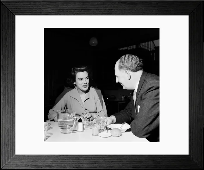 Framed Print : Avis Scott, about to start as a BBC TV Announcer, talking to Paul Boyle of the Sunday