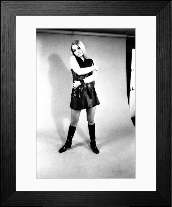 Framed Print : A fashion shoot from 13 April 1970 - A model wears a dress with knee lenght boots