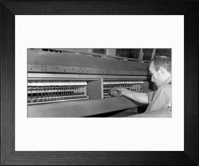 Framed Print : Mr. T. H. Pollard working on the sound board of the Felling organ in December 1946 Framed Print : Mr. T. H. Pollard working on the sound board of the Felling organ in December 1946