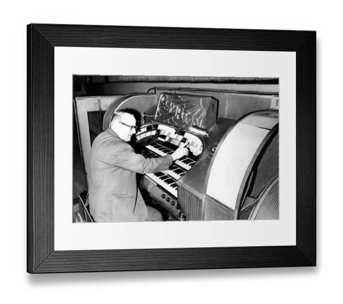 Framed Print : Mr. Wilf Donnelly of the Theatre Organ Club seated at the organ of the Odeon