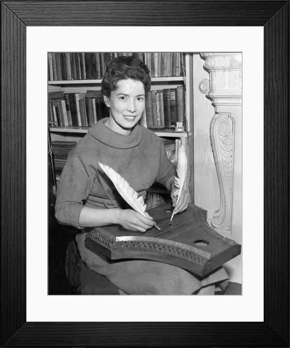 Framed Print : Miss Joan Rimmer of Heath Hurst Road, Hamstead seen playing the psaltery with goose Framed Print : Miss Joan Rimmer of Heath Hurst Road, Hamstead seen playing the psaltery with goose