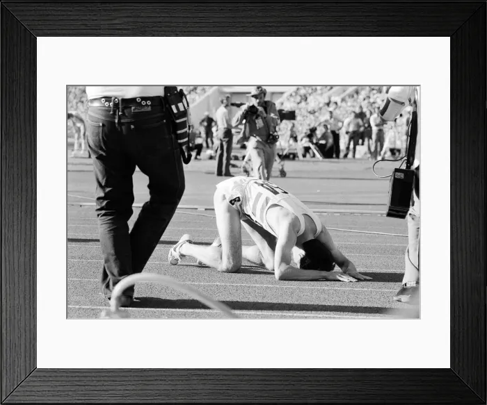 Framed Print : Sebastian Coe collapses to the ground with relief after winning the Mens 1500 metres Framed Print : Sebastian Coe collapses to the ground with relief after winning the Mens 1500 metres