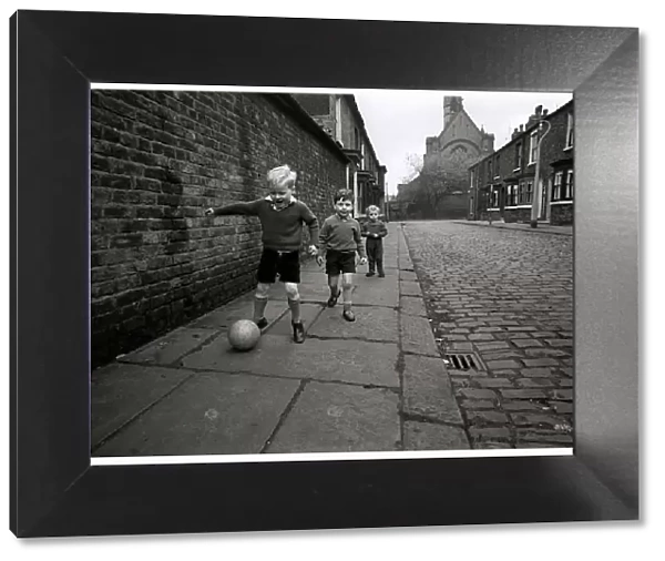 Children playing football on the streets of Manchester in England May 1967