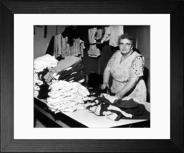 Framed Print : Sara Bratt who does the laundry for Burnley Football Club seen here ironing the teams Framed Print : Sara Bratt who does the laundry for Burnley Football Club seen here ironing the teams