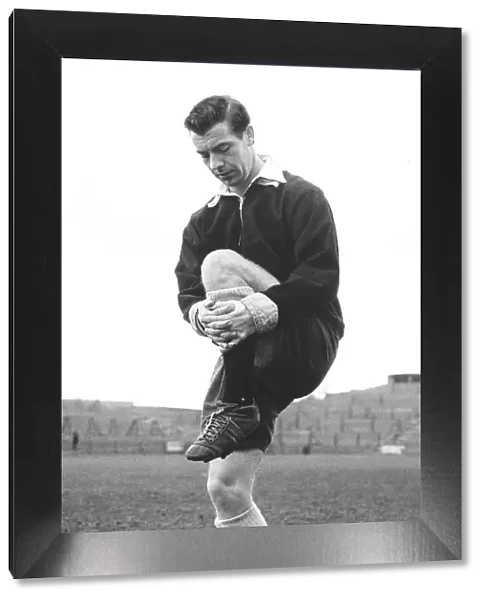 Johnny Haynes footballer captain of Fulham and England limbering up at Craven Cottage