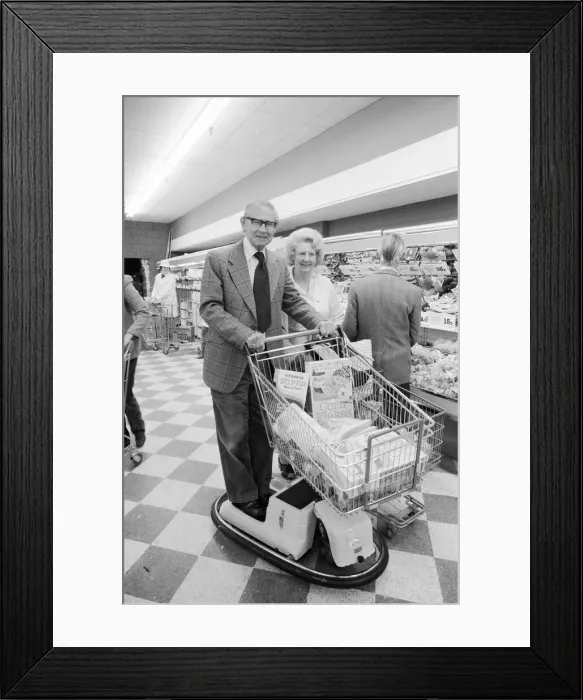 Framed Print : New electric shopping trolley at Tesco, Wandsworth. Old couple giving it a test run Framed Print : New electric shopping trolley at Tesco, Wandsworth. Old couple giving it a test run