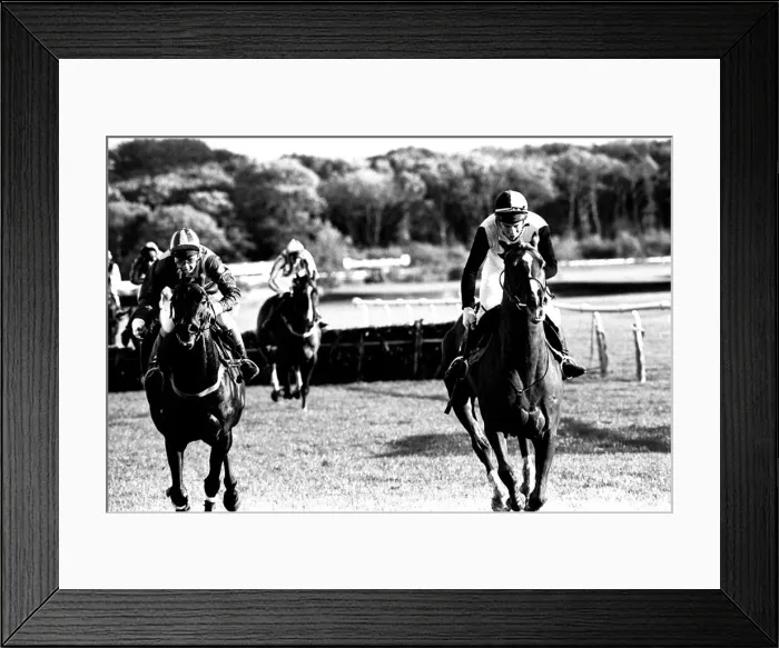 Framed Print : Over the last hurdle safely Narvik (right) is pushed out by Denis Atkins to shrug off