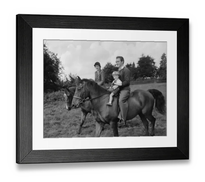 Framed Print : Actor Richard Todd playing with his son Peter on horseback at home Framed Print : Actor Richard Todd playing with his son Peter on horseback at home