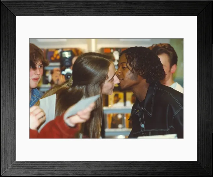 Framed Print : Pop group EYC, Damon Butler gives a young fan a kiss, at the Gateshead Metrocentre 12