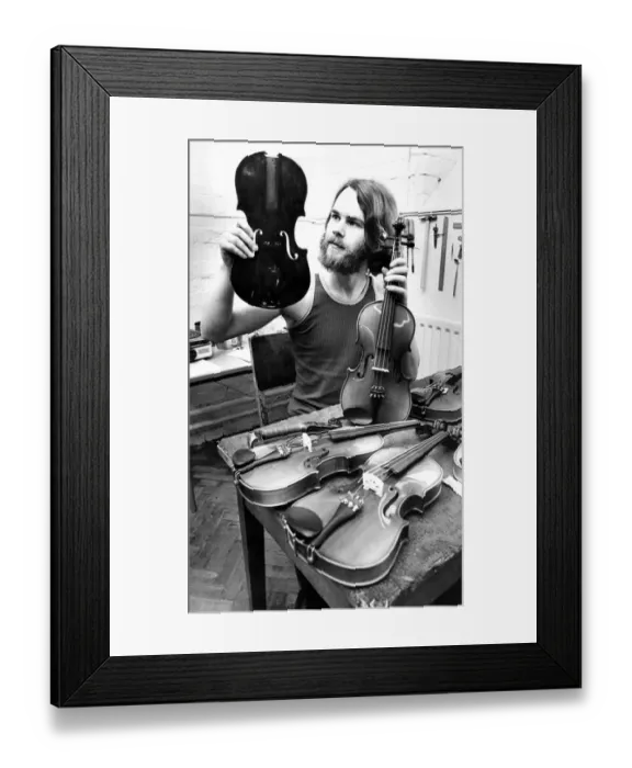 Framed Print : Tarquin Bolton at the Sunderland Violin Hospital in July 1980 set up to repair damaged Framed Print : Tarquin Bolton at the Sunderland Violin Hospital in July 1980 set up to repair damaged