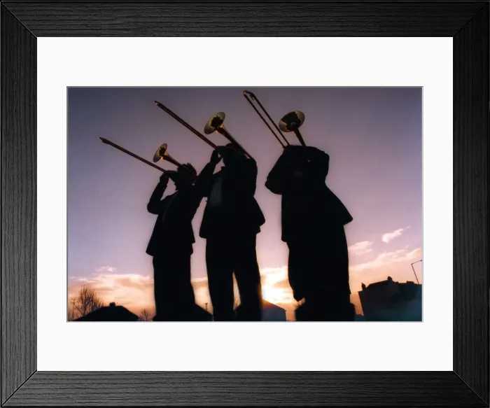 Framed Print : Silhouettes of men playing trombones on December 18, 1997