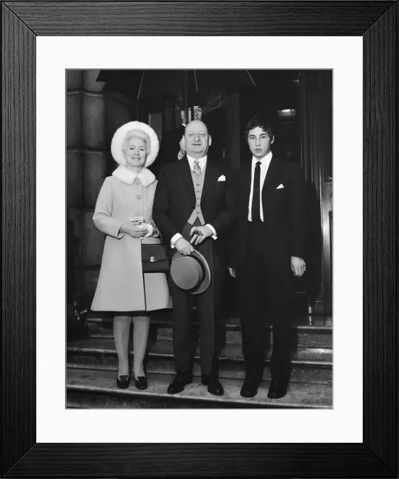 Framed Print : Media Mogul Lew Grade, stands underneath an umbrella with his wife Lady Grade Framed Print : Media Mogul Lew Grade, stands underneath an umbrella with his wife Lady Grade