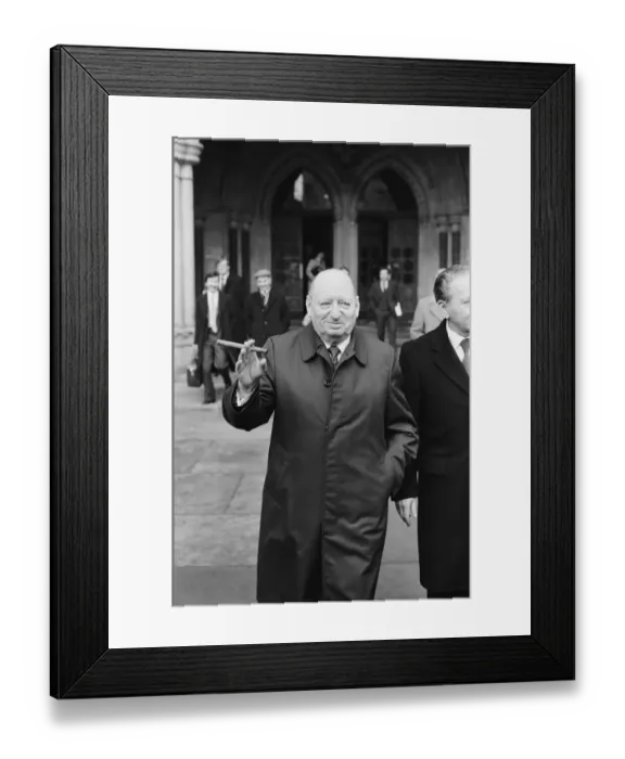 Framed Print : Media Mogul Lew Grade poses outside the High Court in London, smoking one of his cigars Framed Print : Media Mogul Lew Grade poses outside the High Court in London, smoking one of his cigars