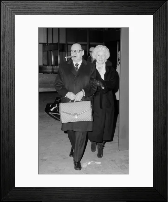 Framed Print : Media Mogul Lew Grade, head of ATV television, arrives at Heathrow Airport with his wife Framed Print : Media Mogul Lew Grade, head of ATV television, arrives at Heathrow Airport with his wife