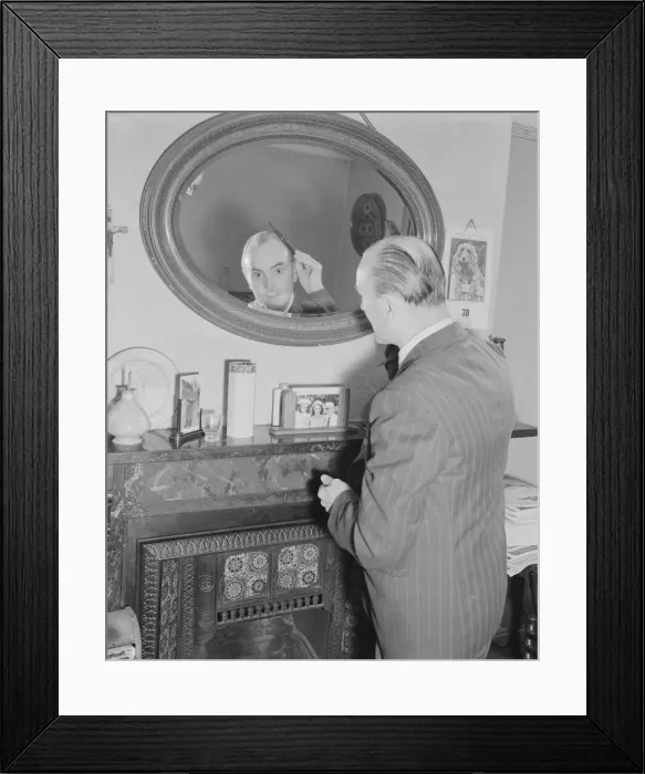 Framed Print : Male Grooming. Mr Frank Hancock seen here combing his hair Framed Print : Male Grooming. Mr Frank Hancock seen here combing his hair