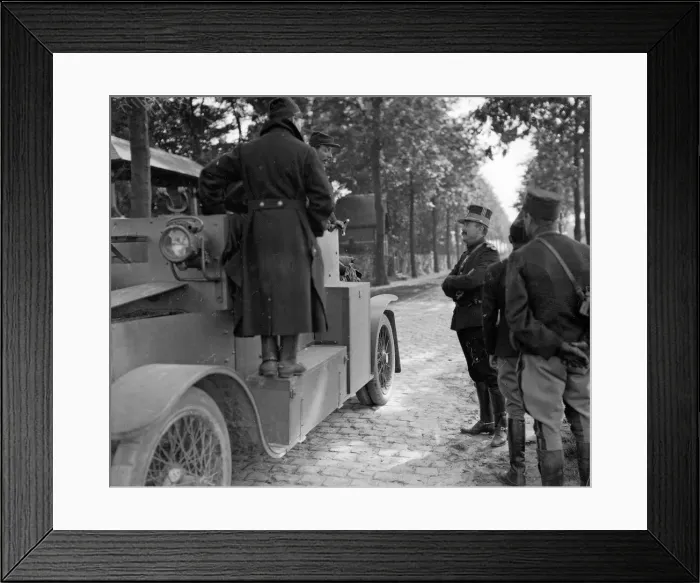 Framed Print : Belgian officers talk to the crew of an armoured car during a lull in the fighting in