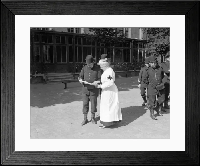Framed Print : A member of the Belgian Civil Guard seen here in Brussels with Red Cross nurse Circa Framed Print : A member of the Belgian Civil Guard seen here in Brussels with Red Cross nurse Circa