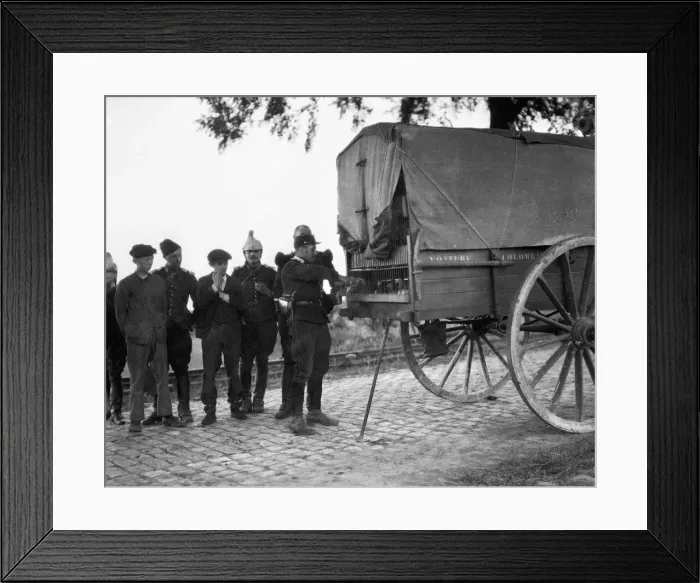 Framed Print : A French Army officer prepares a carrier pigeon to carry a message back to H