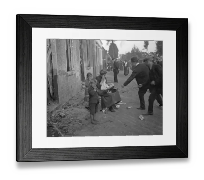 Framed Print : Poor Belgian woman outside her burnt out home in Melle with her two children