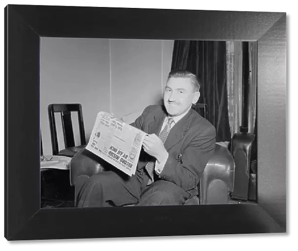 Mr Robert Hope seen here at home reading the Daily Mirror