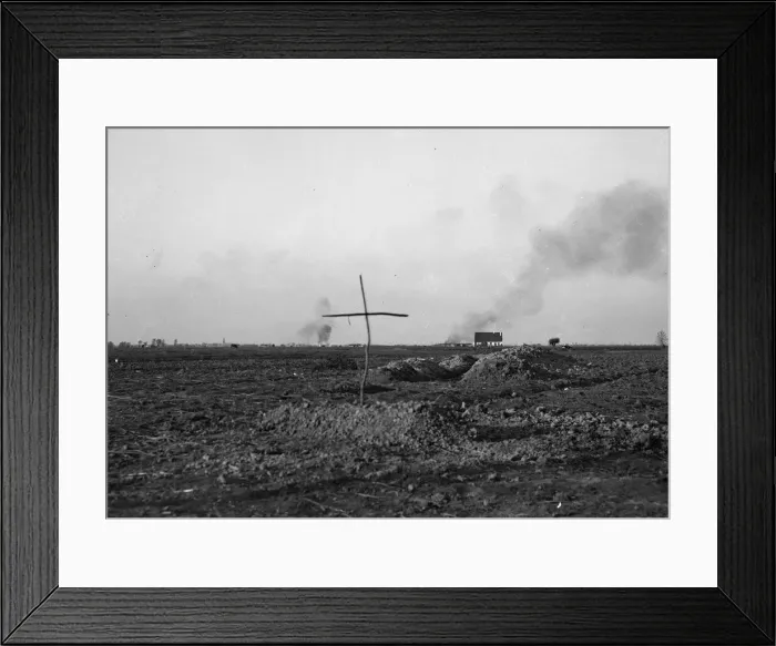 Framed Print : A simple cross marks the spot of a grave of a Belgian soldier killed during the fighting