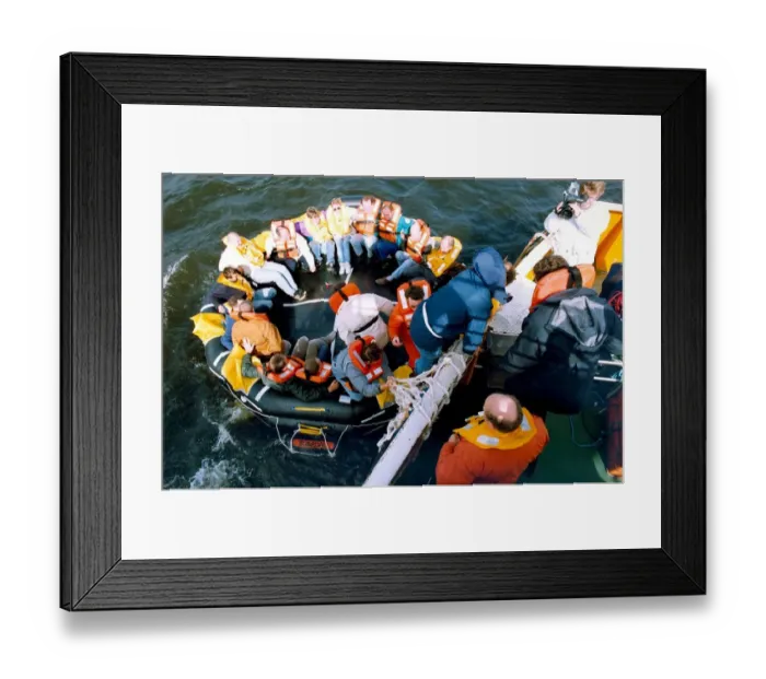 Framed Print : Volunteers clamber into the new life raft during a mock evacuation of the cross Tyne Framed Print : Volunteers clamber into the new life raft during a mock evacuation of the cross Tyne