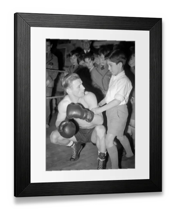 Framed Print : This young man is learning how to fight from a professional boxer. 1949 Framed Print : This young man is learning how to fight from a professional boxer. 1949