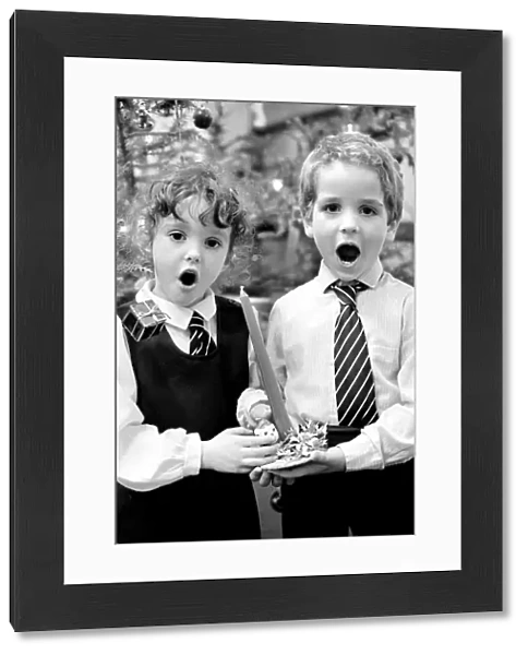 Gemma Glanvilles aged 5 and Jason Owen aged 5, during a Christmas carol concert at