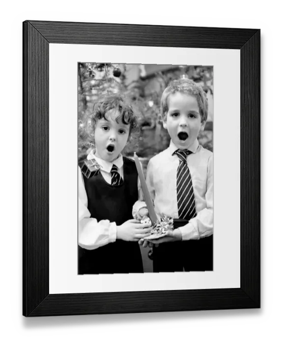 Framed Print : Gemma Glanvilles aged 5 and Jason Owen aged 5, during a Christmas carol concert Framed Print : Gemma Glanvilles aged 5 and Jason Owen aged 5, during a Christmas carol concert