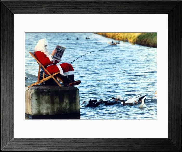 Framed Print : Father Christmas takes time off with a relaxing day Framed Print : Father Christmas takes time off with a relaxing day