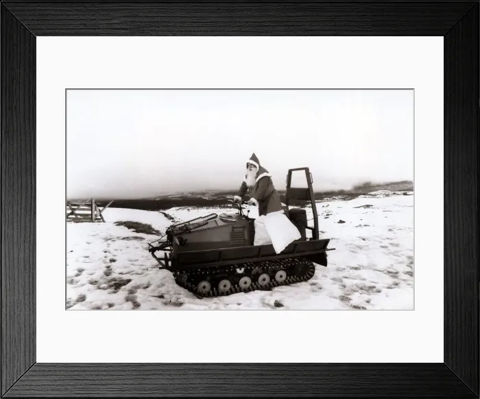 Framed Print : Santas Claus - Father Christmas - December 1987 chooses a snowmobile instead of