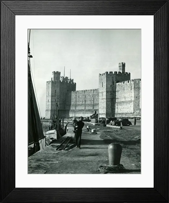 Framed Print : The quay outside the walls of Caernarfon Castle. Inside the castle walls is where Framed Print : The quay outside the walls of Caernarfon Castle. Inside the castle walls is where