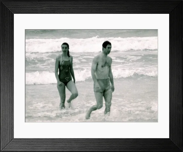 Framed Print : Prince Charles in Australia with unidentified woman. Walking out of the ocean Framed Print : Prince Charles in Australia with unidentified woman. Walking out of the ocean