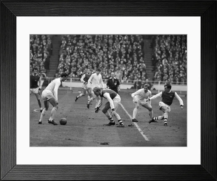 Framed Print : League Cup Final 1968. Arsenal v. Leeds. Paul Madeley with ball at hi feet about to Framed Print : League Cup Final 1968. Arsenal v. Leeds. Paul Madeley with ball at hi feet about to