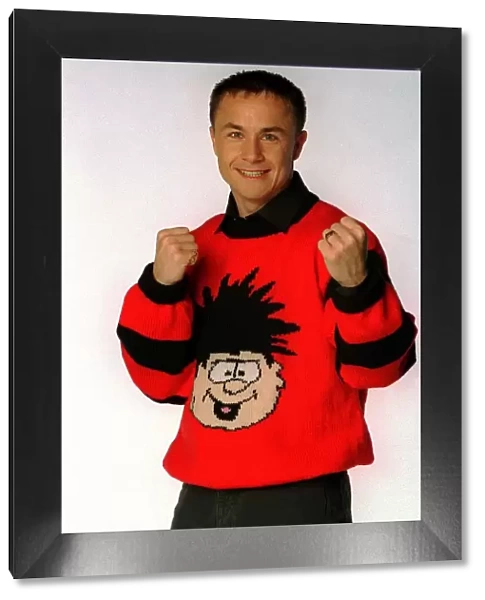Chelsea and England footballer Dennis Wise wearing a Dennis the menace jumper