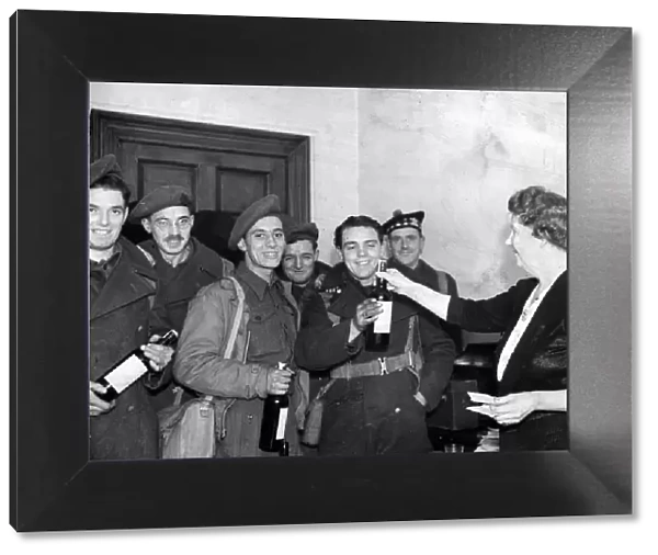 Second World War January 1945 Servicemen on leave receive bottle of whisky