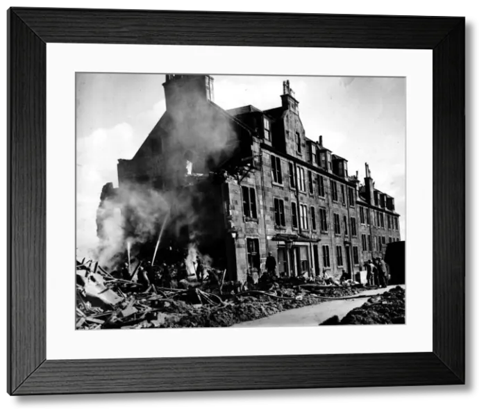 Framed Print : World War Two Firemen damp down a fire at a Scottish tenement block after a German air Framed Print : World War Two Firemen damp down a fire at a Scottish tenement block after a German air
