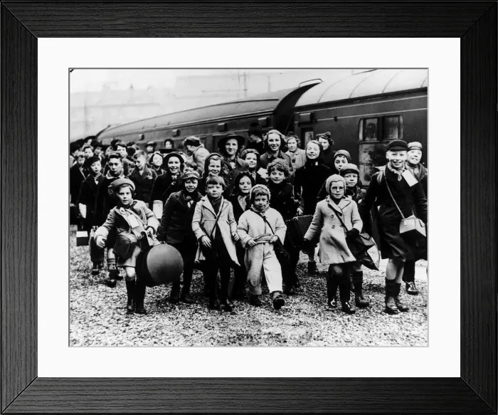 Framed Print : World War Two Children evacuated from the cities disembark from a train in the West Framed Print : World War Two Children evacuated from the cities disembark from a train in the West