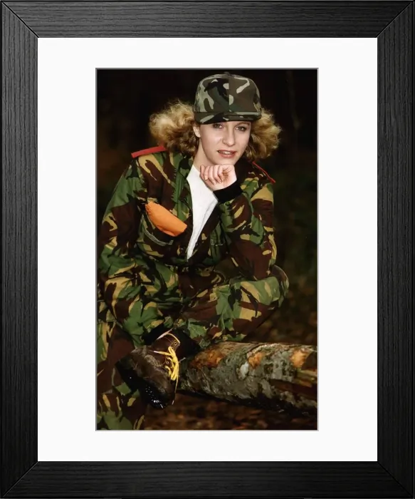 Framed Print : Army Women Female soldier in camouflage resting her chin on her hand - wearing Framed Print : Army Women Female soldier in camouflage resting her chin on her hand - wearing