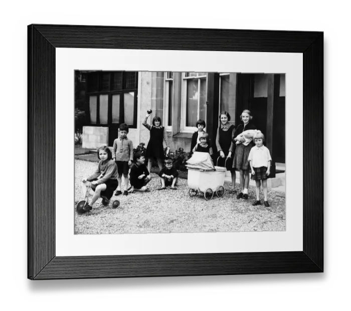 Framed Print : Children evacuated from Glasgow during World War Two play in a garden at Duneira