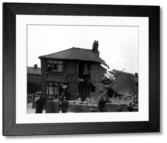 Framed Print : WW2 York Air Raid Bomb Damage Civilians and rescue workers search through a bomb