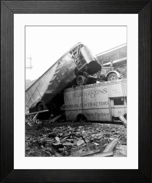 Framed Print : WW2 Air Raid Damage Removal company trucks sit on top of one another after a raid