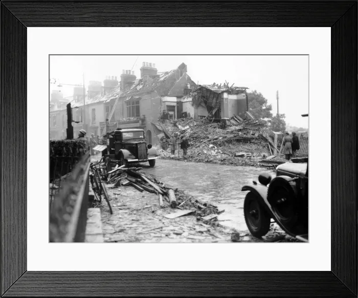 Framed Print : WW2 Air Raid Damage on a London street after a German bombing raid the night