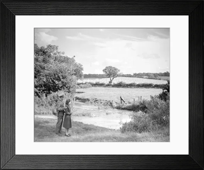 Framed Print : The soldier and his girlfriend look across the ford to the fields and the harvest beyond Framed Print : The soldier and his girlfriend look across the ford to the fields and the harvest beyond