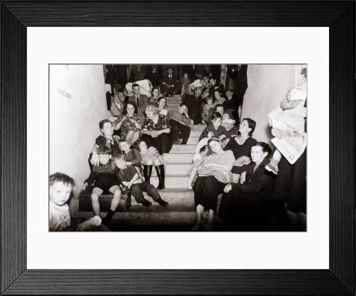 Framed Print : Families take cover from the Luftwaffe bombing of London in this disused London Framed Print : Families take cover from the Luftwaffe bombing of London in this disused London