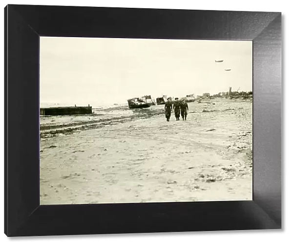 British troops walk along the beach in Normandy after the allied force had landed back in
